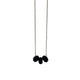 Black polymer clay beads on a gold plated stainless steel chain on a white background