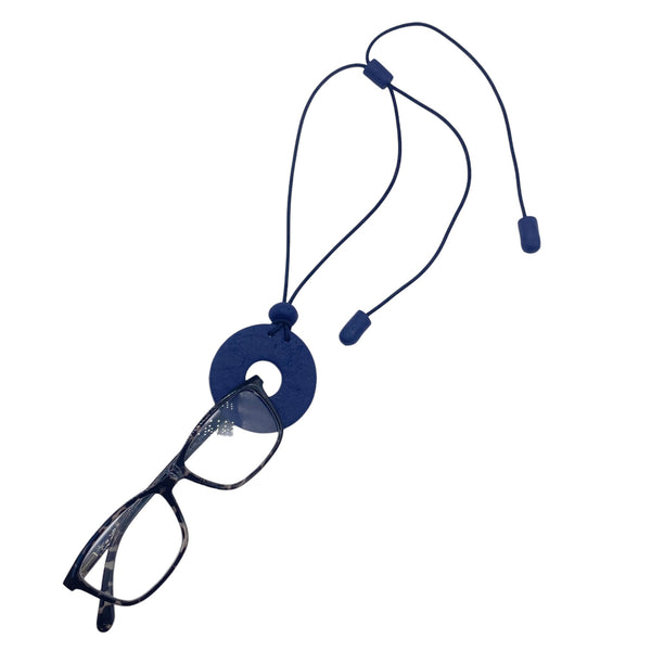 Navy Blue polymer clay statement necklace and glasses holder holding glasses on a white background