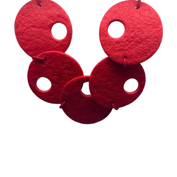 Red polymer clay statement necklace on a white background 