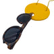 Large yellow Polymer Clay Statement necklace holding sunglasses on a white background