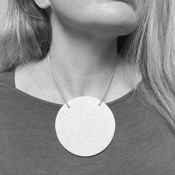 Showing someone wearing Cassandra necklace